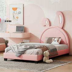 a bedroom with pink walls and furniture in the corner, including a bed frame that has an animal head on it