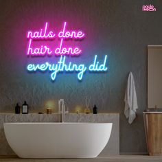 a bathroom with a neon sign that says nails done, hair done, everything did