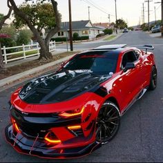 a red sports car parked on the street