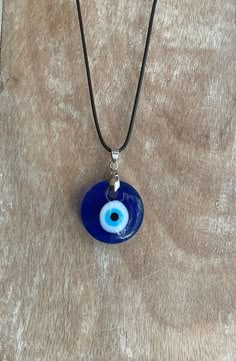 "Free Shipping when you spend $35 at Moondance Trading. Our Products are the same as shown in the pictures. We do not use substitute images. Shapes, sizes, and colors may slightly vary. Everything ships directly from our studio in Orlando, FL. USA Beautiful Handmade Blue Evil Eye Necklace can also be used as wall decor, rearview mirror hang, rearview car mirror decor, car accessory, car decor to bring protection and good luck to you, your loved ones. It has an 18\" vaxed cord and a 2\" chain for Blue Eye Accessories, Jewellery Evil Eye, Eye Of Evil Necklace, Blue Eye Jewelry, Evil Eye Pendant Necklace, Things That Bring Good Luck, Turkish Eye Jewelry, Evil Eye Chains, Nazar Eye Necklace