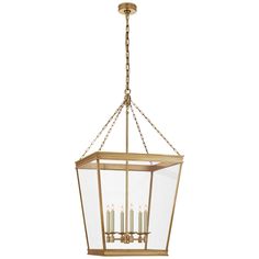 a hanging light fixture with four candles