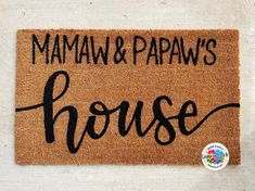 a door mat with the words mama and papaw's house written on it