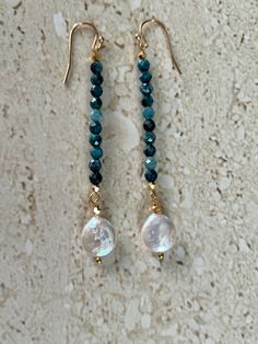 Neon Apatite earrings featuring 5MM faceted neon apatite stones accented with a coin pearl and gold filled ear wires.  Earrings measure 2 1/2 inches.  Handmade GIFT BOXED Apatite Dangle Earrings With Natural Stones, Pearl Long Earrings, Coin Pearl Earrings, Ear Art, Long Pearl Earrings, Stacked Earrings, Pearl Dangle Earrings, Coin Pearls, Earrings Inspiration