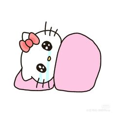 a hello kitty laying on top of a pillow with a pink bow around it's neck