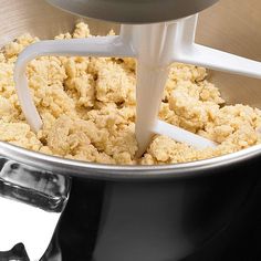 a food processor is full of ingredients for making cookies