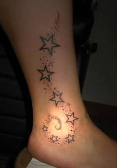 a woman's foot with stars on it and the number six in the middle