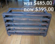 a wooden crate sitting on top of a hard wood floor