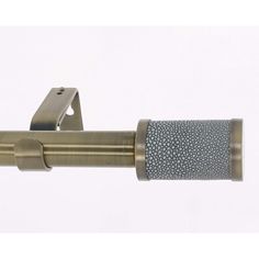 a close up of a metal curtain rod