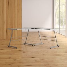 a white table sitting on top of a hard wood floor