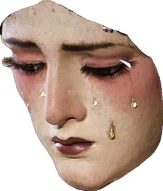 a woman's face with tears and tears on it