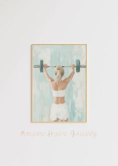 a woman lifting a barbell with the words modern fitness gallery above her head in front of a white wall