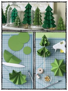 some paper trees and scissors on a table