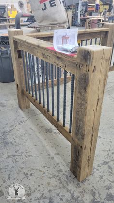 a wooden bench made out of pallets with metal bars on the top and bottom