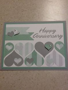 a happy anniversary card with lots of hearts