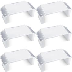 six white plastic trays with dividers on each side and one shelf below them