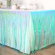 the table is covered with blue and green streamers