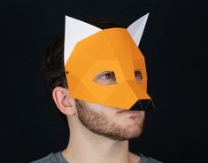 Make your own 3D fox masquerade with paper or cardboard at home in minutes thanks to our printable template for kids and adults. ⚡ If you purchase this product you will have instant access to the PDF file (with easy-to-follow instructions and pattern) so you can print, assemble and customize the papercraft mask to your liking. 📐 Mask dimensions: 16,1 cm x 19,1 cm x 16 cm / 6.3'' x 7.5'' x 6.3''. 📌 PDF content: 7 pages, 8 pieces. 🌲 For every mask you buy, we plant a tree!  ➤ https://hekreation Fox Mask Diy, Papercraft Mask, Low Poly Mask, Mask Printable, Cardboard Mask, Mascaras Halloween, Printable Masks, Animal Mask, Dog Mask