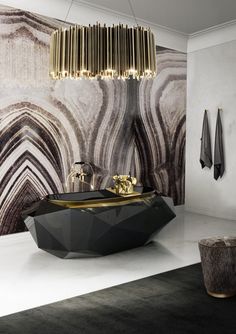 a modern bathroom with black and gold decor