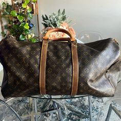 I Changed The Leather Lining With Authentic Lv Leather Due To Water Mark Why It’s Different From The Handle Color. Hence The Price. Gold Zipper Is Tarnished From Use. Comes With Authentic Lv Lock And Key. Please Look At Pictures What You See Is What You Get. ** Poshmark Authenticates Items Sold Above $500** Designer Monogram Canvas Bags, Luxury Monogram Bags, Tan Travel Bag With Monogram, Designer Pre-owned Travel Bags, Designer Travel Bag With Monogram Print, Luxury Pre-owned Bags, Tan Monogram Travel Bag, Elegant Tan Monogram Bag, Classic Travel Bag With Monogram Print