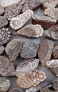 some very pretty wooden hearts with designs on them