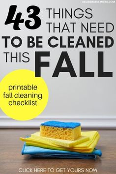 a yellow and blue sponge sitting on top of a wooden table next to a white wall