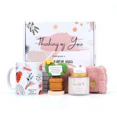 an assortment of items that include candles, coffee mugs and other personal care products