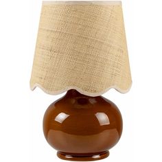 a brown table lamp with a beige shade on it's base and a white linen lampshade