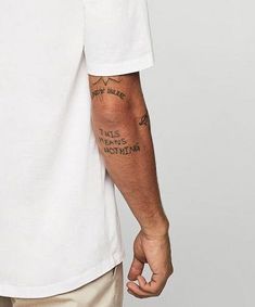 a man with a tattoo on his arm