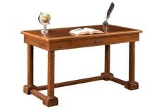 a desk with a book, pen and globe on it's end table in front of a white background