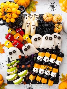 a table topped with lots of halloween treats