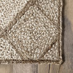 an area rug on top of a wooden floor