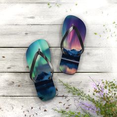 "All-day comfort is the name of the game when summer is on. With an easy slip-on aurora borealis design, a cushioned footbed, and top-tier printing fidelity, these flip flops are a must have! Key Features:  .: 5/8\" (15 mm) thick EVA sole .: 100% polyester suede sole cover .: Runs true to size .: Black PVC strap .: Multiple sizes Stay Connected: Follow us on Instagram (@phoenixbywombdesigns) for the latest updates, exclusive offers, and style inspiration. Explore our Pinterest page (@phoenixwombdesigns) for even more creative ideas and curated collections that ignite your artistic spirit." Dancing Lights, Norway Nature, Hip Hop Dancer, Dance Teacher Gifts, Nature Mountains, Black Pvc, Stil Inspiration, Pet Memorial Gifts, Eva Sole