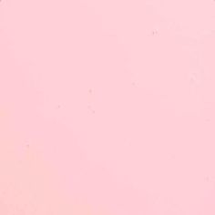 an airplane is flying in the sky on a pink background