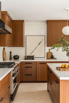 a kitchen with wooden cabinets and white counter tops