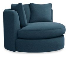 a large blue chair with pillows on it's back and the seat upholstered