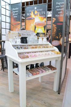 a table with many items on it in a room that looks like a store or restaurant