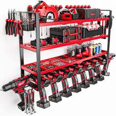 a red and black tool rack filled with tools