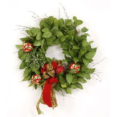 a green wreath with red and gold ornaments