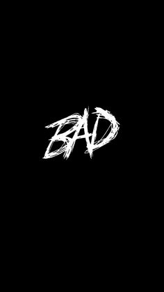 the word bad written in white ink on a black background with some type of graffiti