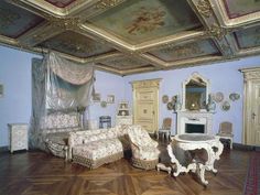 an ornately decorated living room with blue walls