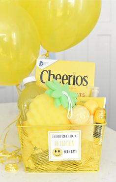 a basket filled with lots of yellow balloons