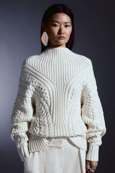 Indulge In Knit Luxury With This Jumper, Crafted From Sumptuous Knit Fabric With A Cable Pattern For Textural Enhancement. Finished With A High Neck And Long Balloon Sleeves For Cooler Season Wear That Is Sure To Keep You Cosy.Round Neckballoon Sleevesknitcable Pattern Knitted Cable Patterns, Chic Cable Knit Turtleneck Sweater, Chic Turtleneck Cable Knit Sweater, Fitted High Neck Cable Knit Sweater, Fitted Cable Knit Sweater With Funnel Neck, Wool Cable Knit High Neck Sweater, High Neck Wool Sweater With Textured Knit, Cable Knit Long Sleeve Turtleneck, Long Sleeve Cable Knit Turtleneck