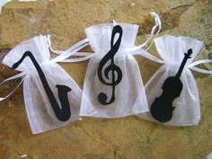 three bags with musical notes on them