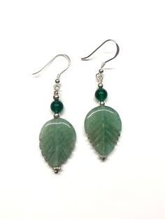 This pair of earrings are made with green aventurine leaves and green onyx beads. - Made with green aventurine leaves, green onyx beads and 925 sterling silver beads, 925 sterling silver wires and 925 sterling silver hooks - Approximately 50 mm / 1.97 inches in length - Approximaely 20 mm / 0.79 inches in length (longest part) and 15 mm / 0.59 inches in width (widest part) of the green aventurine leaf - Approximately 6 mm diameter of green onyx bead Visit my shop for more: http://www.etsy.com/ca/shop/RitaCollection If you have any questions regarding the item or my store in general, feel free to message me! Green Aventurine Earrings, Green Silver Earrings, Green And Black Earrings, Gem Stone Earrings, Dragon Bracelet, Jade Earrings, Onyx Earrings, Leaf Jewelry, Earrings Green