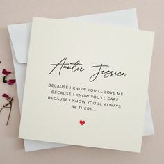 a card with the words annie fossa written on it next to some flowers