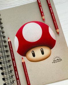 a drawing of a mushroom with two pencils next to it