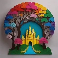 a paper cut out of a castle with trees