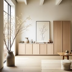 a living room filled with lots of furniture and vases on top of wooden tables