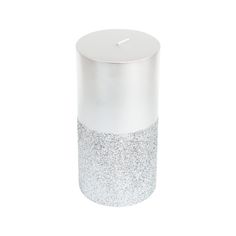 a white and silver canister sitting on top of a white surface with a lid