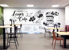 an empty restaurant with tables and chairs in front of a wall that says forty layer cake